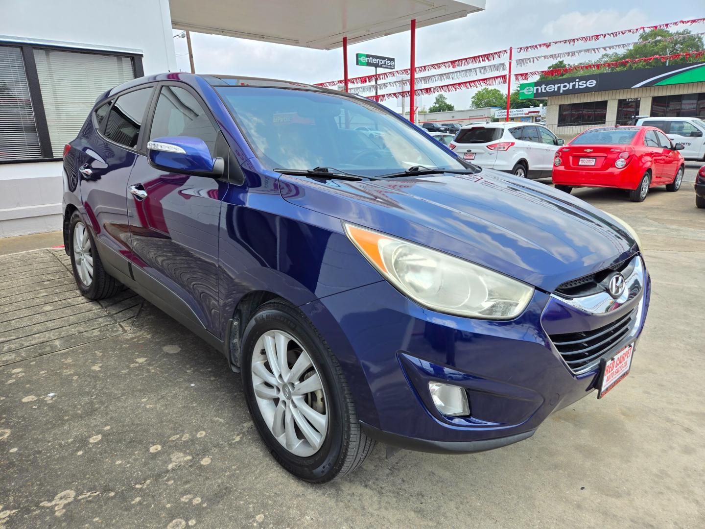 2013 Blue Hyundai Tucson Limited 2WD (KM8JU3AC4DU) with an 2.4L L4 DOHC 16V engine, 6-Speed Automatic transmission, located at 503 West Court, Seguin, TX, 78155, (830) 379-3373, 29.568621, -97.969803 - Photo#1